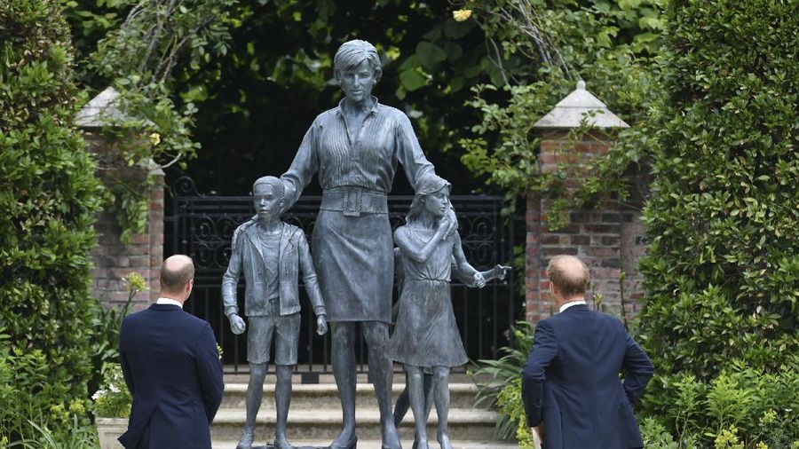Britain's Prince William and Prince Harry arrive for the statue unveiling on what woud have been Princess Diana's 60th birthday, in the Sunken Garden at Kensington Palace, London, Thursday July 1, 2021. (Yui Mok/Pool Photo via AP)