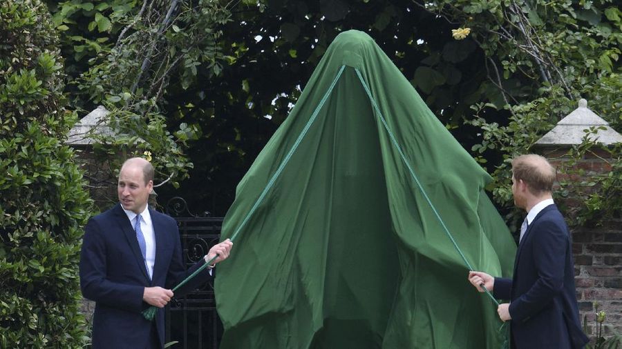 Britain's Prince William and Prince Harry arrive for the statue unveiling on what woud have been Princess Diana's 60th birthday, in the Sunken Garden at Kensington Palace, London, Thursday July 1, 2021. (Yui Mok/Pool Photo via AP)