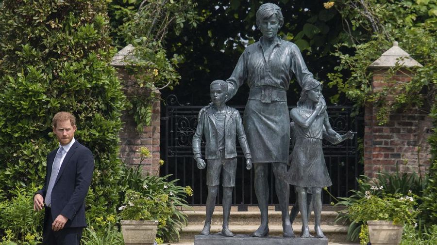 Britain's Prince William and Prince Harry arrive for the statue unveiling on what woud have been Princess Diana's 60th birthday, in the Sunken Garden at Kensington Palace, London, Thursday July 1, 2021. (Yui Mok/Pool Photo via AP)