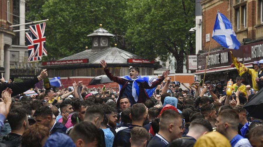 England fans celebrate during the Euro 2020 soccer championship round of 16 match between England and Germany at Wembley Stadium in England, Tuesday June 29, 2021. (Justin Tallis, Pool Photo via AP)