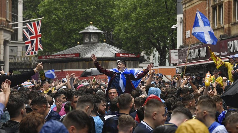 England fans celebrate during the Euro 2020 soccer championship round of 16 match between England and Germany at Wembley Stadium in England, Tuesday June 29, 2021. (Justin Tallis, Pool Photo via AP)