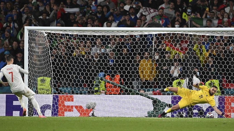 Italy's Federico Chiesa, right, scores the opening goal during the Euro 2020 soccer championship semifinal match between Italy and Spain at Wembley stadium in London, Tuesday, July 6, 2021. (Facundo Arrizabalaga/Pool Photo via AP)