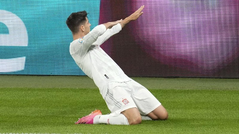 Italy's Federico Chiesa, right, scores the opening goal during the Euro 2020 soccer championship semifinal match between Italy and Spain at Wembley stadium in London, Tuesday, July 6, 2021. (Facundo Arrizabalaga/Pool Photo via AP)