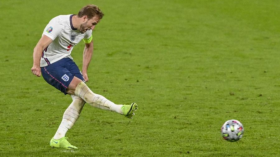 Denmark's Mikkel Damsgaard, left, scores his side's opening goal from a free kick during the Euro 2020 soccer semifinal match between England and Denmark at Wembley stadium in London, Wednesday, July 7, 2021. (Laurence Griffiths/Pool Photo via AP)