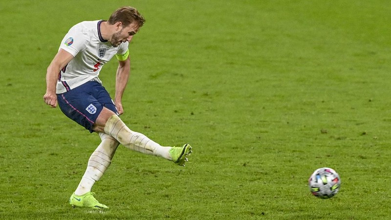 Denmark's Mikkel Damsgaard, left, scores his side's opening goal from a free kick during the Euro 2020 soccer semifinal match between England and Denmark at Wembley stadium in London, Wednesday, July 7, 2021. (Laurence Griffiths/Pool Photo via AP)