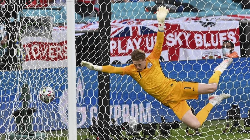 Denmark's Mikkel Damsgaard, left, scores his side's opening goal from a free kick during the Euro 2020 soccer semifinal match between England and Denmark at Wembley stadium in London, Wednesday, July 7, 2021. (Laurence Griffiths/Pool Photo via AP)