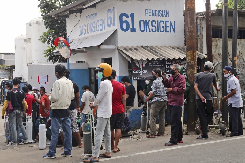 Virus Outbreak In this photo released by Indonesian Armed Forces, a military personnel uses a forklift to unload relief goods from a Singaporean Air Force cargo plane at Halim Perdanakusuma Airbase in Jakarta, Indonesia, Friday, July 9, 2021. The world's fourth most populous country is running out of oxygen as it endures a devastating wave of coronavirus cases and the government is seeking emergency supplies from other countries, including Singapore and China. (Indonesian Armed Forces via AP)