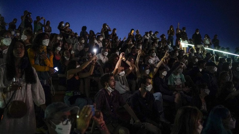 People attend the Cruilla music festival in Barcelona, Spain, Friday, July 9, 2021. (AP Photo/Joan Mateu)
