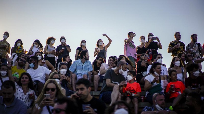 People attend the Cruilla music festival in Barcelona, Spain, Friday, July 9, 2021. (AP Photo/Joan Mateu)