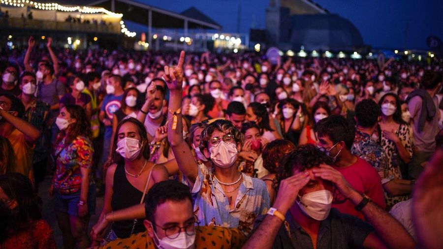 People attend the Cruilla music festival in Barcelona, Spain, Friday, July 9, 2021. (AP Photo/Joan Mateu)