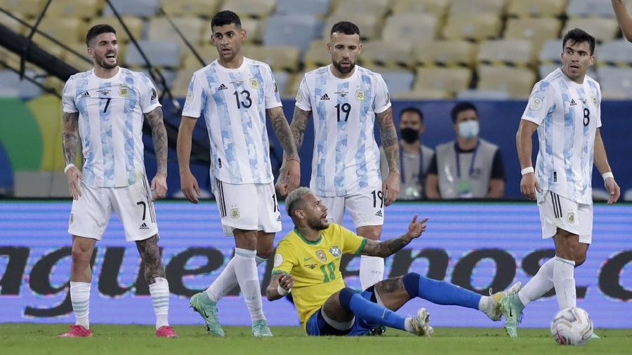 Argentina's Lionel Messi holds the trophy as he celebrates with the team after beating 1-0 Brazil in the Copa America final soccer match at the Maracana stadium in Rio de Janeiro, Brazil, Saturday, July 10, 2021. (AP Photo/Andre Penner)