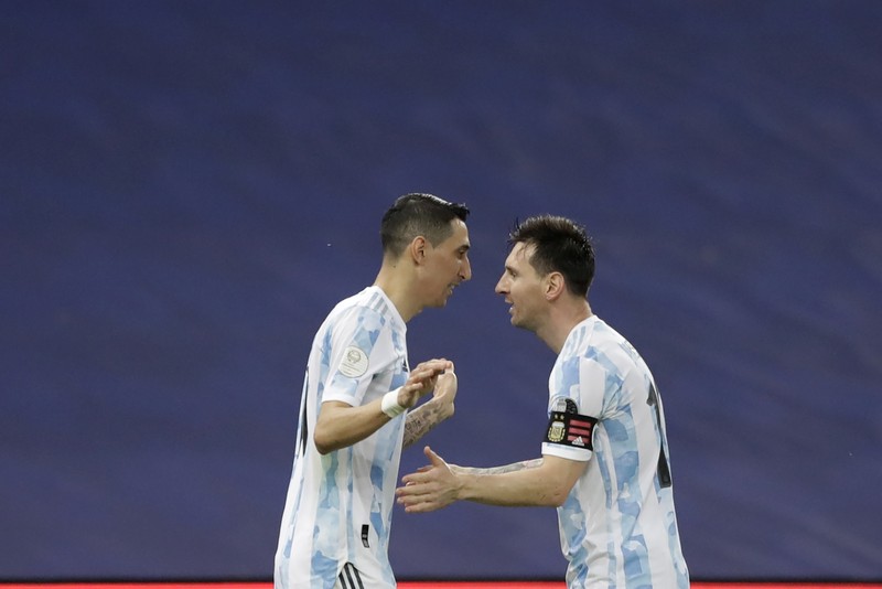 Brazil Argentina Copa America Soccer Argentina's Lionel Messi holds the trophy as he celebrates with the team after beating 1-0 Brazil in the Copa America final soccer match at the Maracana stadium in Rio de Janeiro, Brazil, Saturday, July 10, 2021. (AP Photo/Andre Penner)