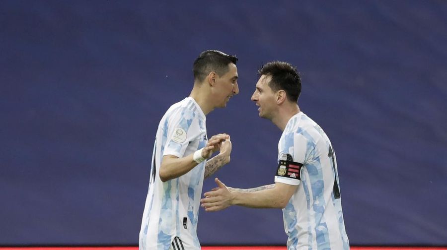 Argentina's Lionel Messi holds the trophy as he celebrates with the team after beating 1-0 Brazil in the Copa America final soccer match at the Maracana stadium in Rio de Janeiro, Brazil, Saturday, July 10, 2021. (AP Photo/Andre Penner)