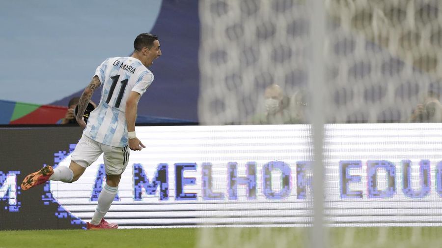 Argentina's Lionel Messi holds the trophy as he celebrates with the team after beating 1-0 Brazil in the Copa America final soccer match at the Maracana stadium in Rio de Janeiro, Brazil, Saturday, July 10, 2021. (AP Photo/Andre Penner)