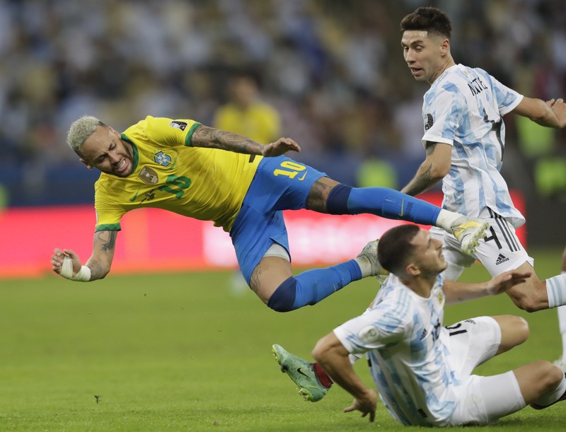 Brazil Argentina Copa America Soccer Argentina's Lionel Messi holds the trophy as he celebrates with the team after beating 1-0 Brazil in the Copa America final soccer match at the Maracana stadium in Rio de Janeiro, Brazil, Saturday, July 10, 2021. (AP Photo/Andre Penner)