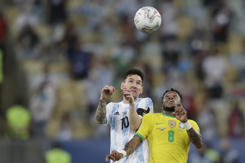 Brazil Argentina Copa America Soccer Argentina's Lionel Messi holds the trophy as he celebrates with the team after beating 1-0 Brazil in the Copa America final soccer match at the Maracana stadium in Rio de Janeiro, Brazil, Saturday, July 10, 2021. (AP Photo/Andre Penner)