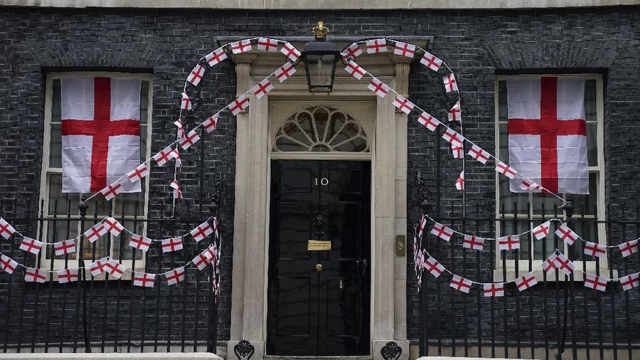 A view of 10 Downing Street, the official residence of Britain's Prime Minister Boris Johnson, decorated with England flag bunting, ahead of the Euro 2020 soccer championship final match between England and Italy   on Sunday, in London, Friday, July 9, 2021. (Aaron Chown/PA via AP)