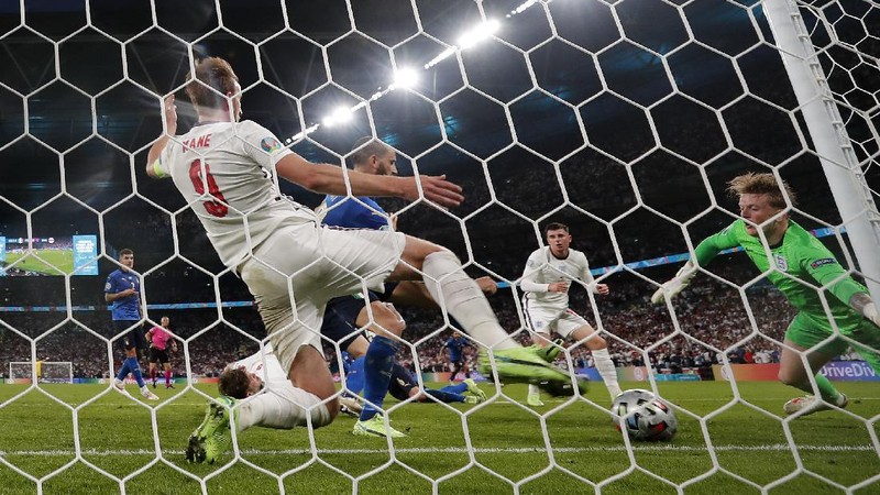 Italy's team celebrates with the trophy on the podium after winning the Euro 2020 soccer championship final between England and Italy at Wembley stadium in London, Sunday, July 11, 2021. (Michael Regan/Pool via AP)