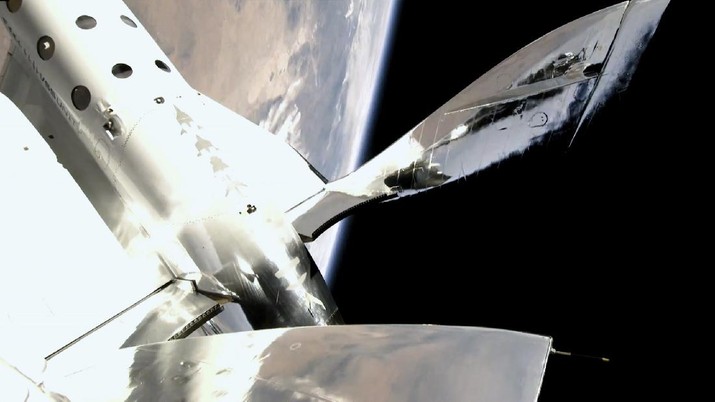In this photo provided by Virgin Galactic, the VSS Unity reaches a speed of Mach 3, and a space altitude of 53.5 miles above the Earth on Sunday, July 11, 2021. Entrepreneur Richard Branson and five crewmates from his Virgin Galactic space-tourism company reached an altitude of about 53 miles (88 kilometers) over the New Mexico desert, enough to experience three to four minutes of weightlessness and see the curvature of the Earth. (Virgin Galactic via AP)