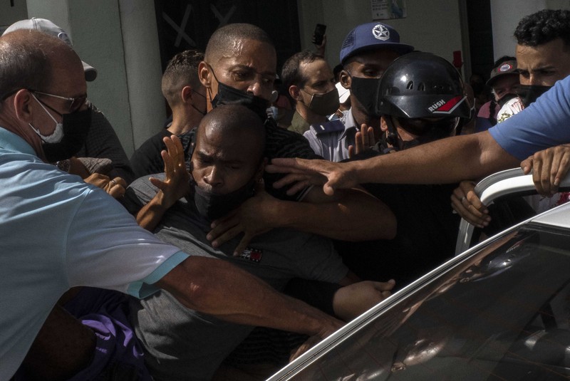 Cuba Protest Backers of the government march in Havana, Cuba, Sunday, July 11, 2021. Hundreds of supporters of the government took to the streets while hundreds more protested against ongoing food shortages and high prices of foodstuffs. (AP Photo/Eliana Aponte)