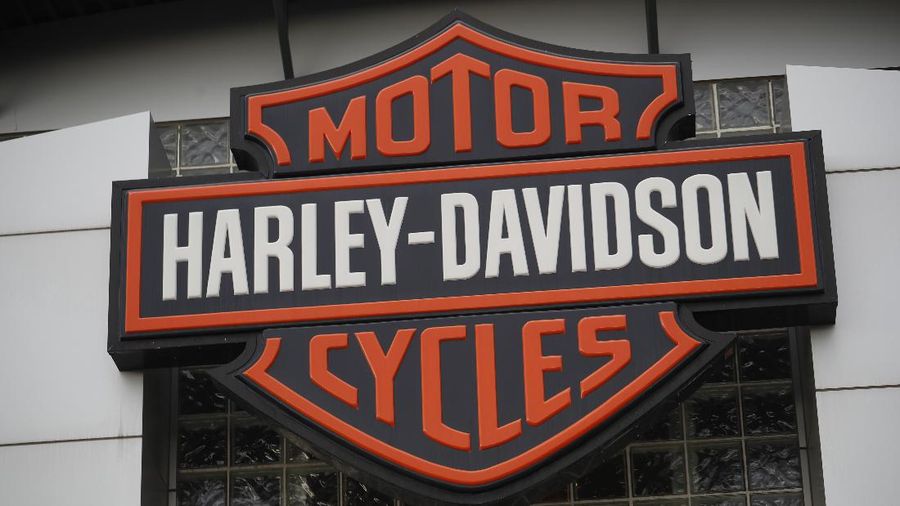 In this Sunday, Oct. 20, 2019, photograph, the company logo hangs over the entrance to a Harlet Davidson dealership in Littleton, Colo. (AP Photo/David Zalubowski)