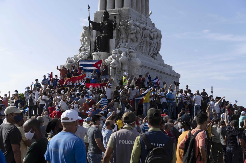 Cuba Protest Backers of the government march in Havana, Cuba, Sunday, July 11, 2021. Hundreds of supporters of the government took to the streets while hundreds more protested against ongoing food shortages and high prices of foodstuffs. (AP Photo/Eliana Aponte)