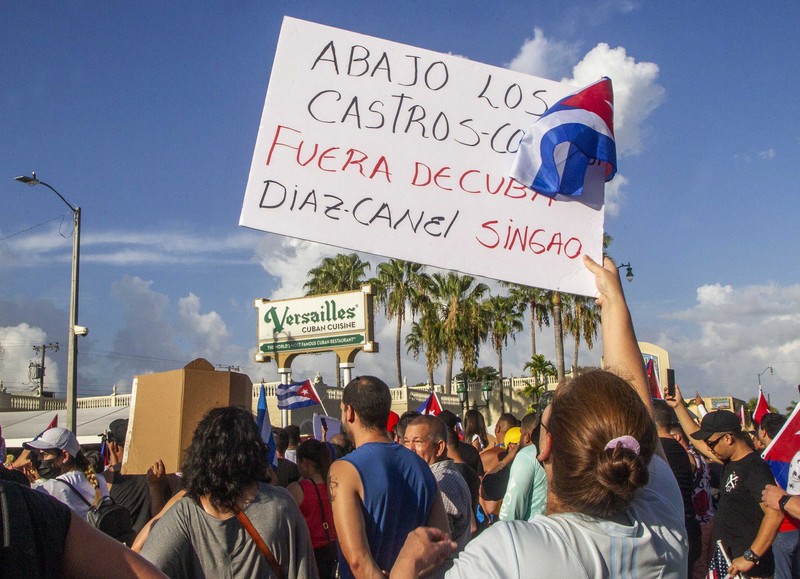 Backers of the government march in Havana, Cuba, Sunday, July 11, 2021. Hundreds of supporters of the government took to the streets while hundreds more protested against ongoing food shortages and high prices of foodstuffs. (AP Photo/Eliana Aponte)