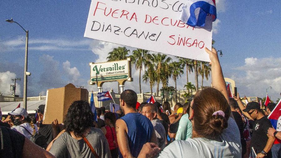 Backers of the government march in Havana, Cuba, Sunday, July 11, 2021. Hundreds of supporters of the government took to the streets while hundreds more protested against ongoing food shortages and high prices of foodstuffs. (AP Photo/Eliana Aponte)