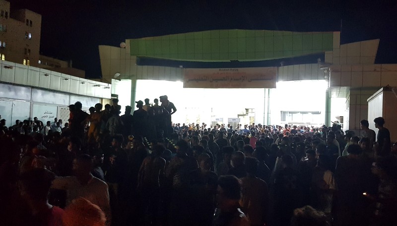 Iraq Hospital Fire People gather outside a COVID-19 hospital in Nasiriyah, Iraq, early Tuesday, July 13, 2021. A catastrophic blaze erupted at the coronavirus hospital ward. It was the second time a large fire killed coronavirus patients in an Iraqi hospital this year. (AP Photo)