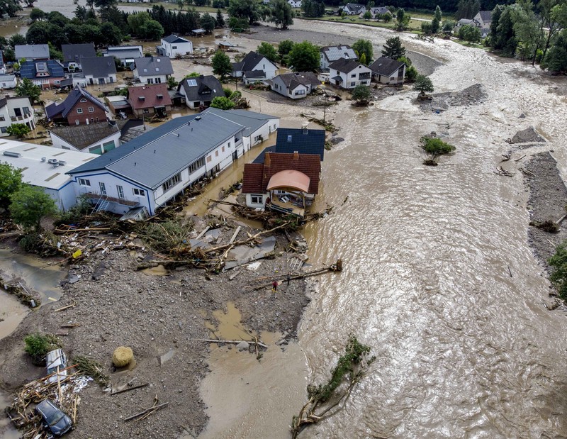 Destroyed houses are seen close to the Ahr river in Schuld, Germany, Thursday, July 15, 2021. Due to heavy rain falls the Ahr river dramatically went over the banks the evening before. People have died and dozens of people are missing in Germany after heavy flooding turned streams and streets into raging torrents, sweeping away cars and causing some buildings to collapse. (AP Photo/Michael Probst)