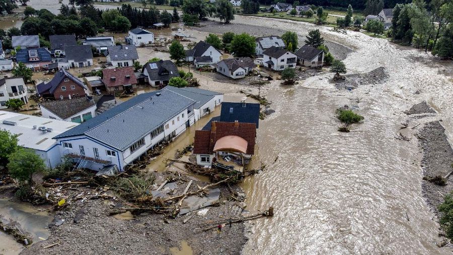 Destroyed houses are seen close to the Ahr river in Schuld, Germany, Thursday, July 15, 2021. Due to heavy rain falls the Ahr river dramatically went over the banks the evening before. People have died and dozens of people are missing in Germany after heavy flooding turned streams and streets into raging torrents, sweeping away cars and causing some buildings to collapse. (AP Photo/Michael Probst)