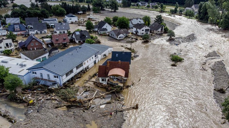 Destroyed houses are seen close to the Ahr river in Schuld, Germany, Thursday, July 15, 2021. Due to heavy rain falls the Ahr river dramatically went over the banks the evening before. People have died and dozens of people are missing in Germany after heavy flooding turned streams and streets into raging torrents, sweeping away cars and causing some buildings to collapse. (AP Photo/Michael Probst)