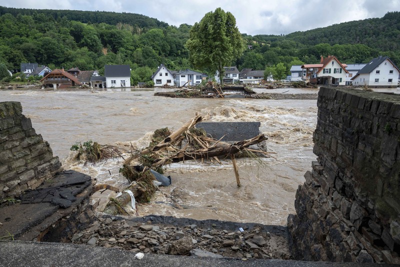 APTOPIX Germany Europe Weather Destroyed houses are seen close to the Ahr river in Schuld, Germany, Thursday, July 15, 2021. Due to heavy rain falls the Ahr river dramatically went over the banks the evening before. People have died and dozens of people are missing in Germany after heavy flooding turned streams and streets into raging torrents, sweeping away cars and causing some buildings to collapse. (AP Photo/Michael Probst)