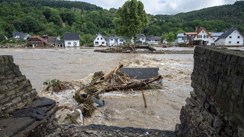 Destroyed houses are seen close to the Ahr river in Schuld, Germany, Thursday, July 15, 2021. Due to heavy rain falls the Ahr river dramatically went over the banks the evening before. People have died and dozens of people are missing in Germany after heavy flooding turned streams and streets into raging torrents, sweeping away cars and causing some buildings to collapse. (AP Photo/Michael Probst)