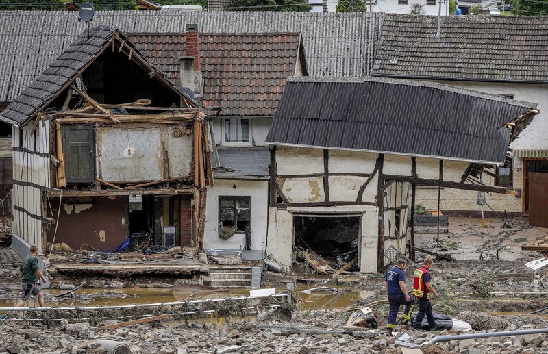 Destroyed houses are seen close to the Ahr river in Schuld, Germany, Thursday, July 15, 2021. Due to heavy rain falls the Ahr river dramatically went over the banks the evening before. People have died and dozens of people are missing in Germany after heavy flooding turned streams and streets into raging torrents, sweeping away cars and causing some buildings to collapse. (AP Photo/Michael Probst)