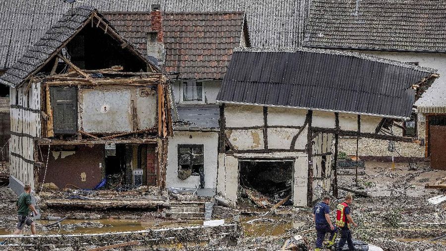 Destroyed houses are seen close to the Ahr river in Schuld, Germany, Thursday, July 15, 2021. Due to heavy rain falls the Ahr river dramatically went over the banks the evening before. People have died and dozens of people are missing in Germany after heavy flooding turned streams and streets into raging torrents, sweeping away cars and causing some buildings to collapse. (AP Photo/Michael Probst)