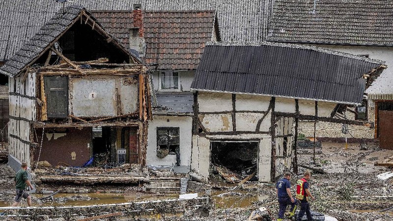 Destroyed houses are seen close to the Ahr river in Schuld, Germany, Thursday, July 15, 2021. Due to heavy rain falls the Ahr river dramatically went over the banks the evening before. People have died and dozens of people are missing in Germany after heavy flooding turned streams and streets into raging torrents, sweeping away cars and causing some buildings to collapse. (AP Photo/Michael Probst)