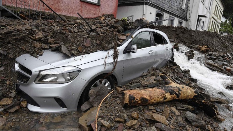 Destroyed houses are seen close to the Ahr river in Schuld, Germany, Thursday, July 15, 2021. Due to heavy rain falls the Ahr river dramatically went over the banks the evening before. People have died and dozens of people are missing in Germany after heavy flooding turned streams and streets into raging torrents, sweeping away cars and causing some buildings to collapse. (AP Photo/Michael Probst)