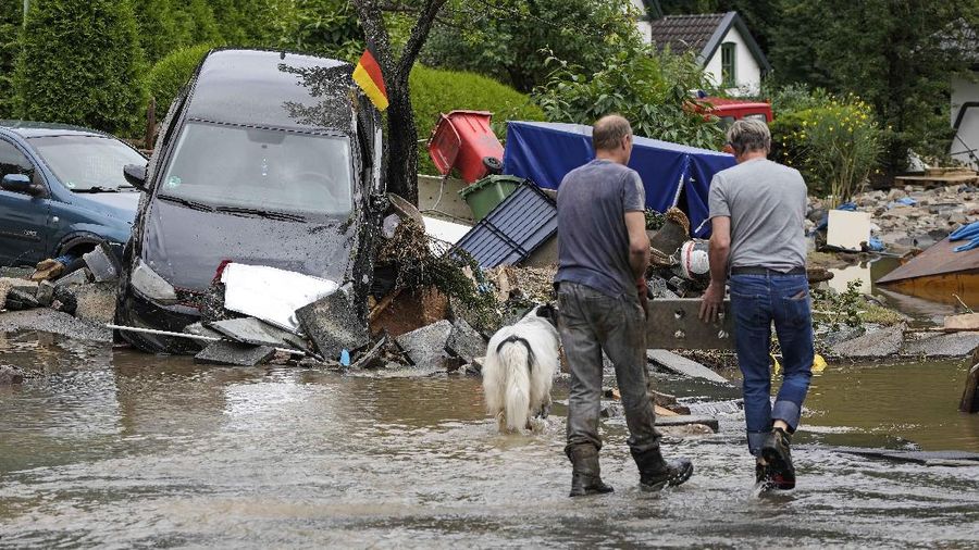 Destroyed houses are seen close to the Ahr river in Schuld, Germany, Thursday, July 15, 2021. Due to heavy rain falls the Ahr river dramatically went over the banks the evening before. People have died and dozens of people are missing in Germany after heavy flooding turned streams and streets into raging torrents, sweeping away cars and causing some buildings to collapse. (AP Photo/Michael Probst)