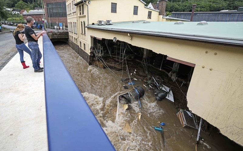 Destroyed houses are seen close to the Ahr river in Schuld, Germany, Thursday, July 15, 2021. Due to heavy rain falls the Ahr river dramatically went over the banks the evening before. People have died and dozens of people are missing in Germany after heavy flooding turned streams and streets into raging torrents, sweeping away cars and causing some buildings to collapse. (AP Photo/Michael Probst)