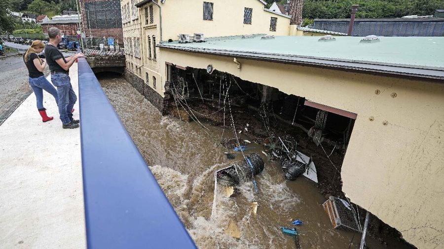 Destroyed houses are seen close to the Ahr river in Schuld, Germany, Thursday, July 15, 2021. Due to heavy rain falls the Ahr river dramatically went over the banks the evening before. People have died and dozens of people are missing in Germany after heavy flooding turned streams and streets into raging torrents, sweeping away cars and causing some buildings to collapse. (AP Photo/Michael Probst)