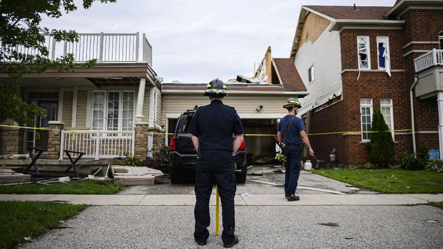 Damage left after a tornado touched down in a neighborhood of Barrie, Ontario, on Thursday, July 15, 2021. (Christopher Katsarov/The Canadian Press via AP)