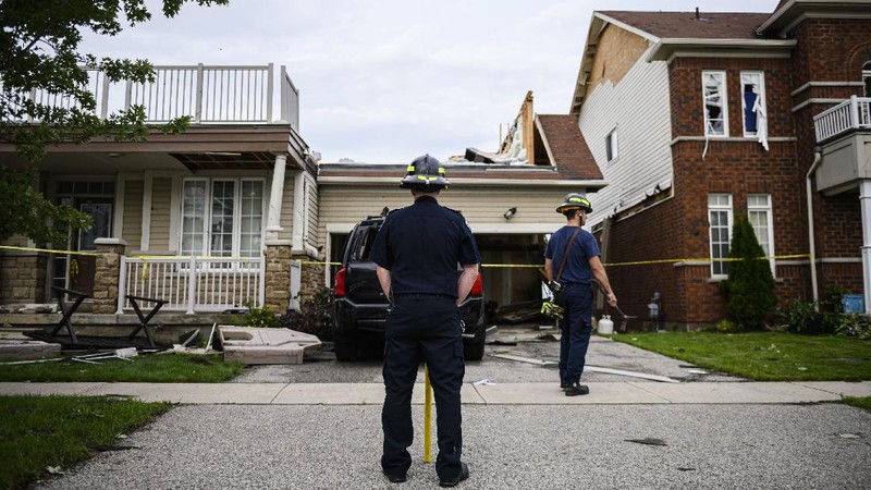 Damage left after a tornado touched down in a neighborhood of Barrie, Ontario, on Thursday, July 15, 2021. (Christopher Katsarov/The Canadian Press via AP)