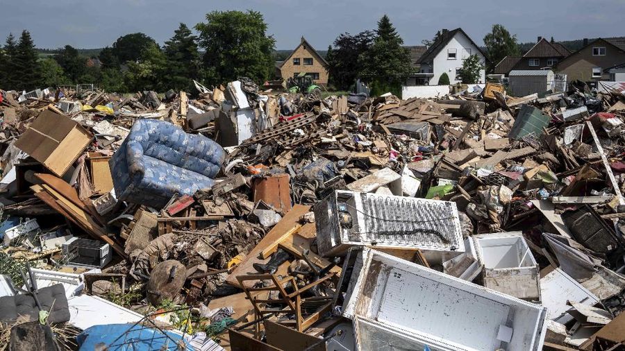 A view of destroyed furniture in a field outside the village of Arloff, in Bad Munstereifel, Germany, Saturday, July 17, 2021. Politicians and weather forecasters have been shocked at the ferocity of the precipitation that caused flash flooding that has claimed more than 150 lives this week in Western Europe. Climate scientists say the link between extreme weather and global warming is unmistakable and the urgency to do something about climate change (Marius Becker/dpa via AP)