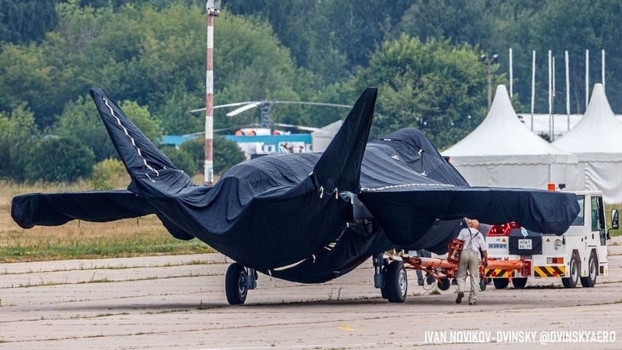 Hidden under tarpaulin, a prospective Russian fighter jet is being towed to a parking spot before its presentation at the Moscow international air show in Zhukovsky outside Moscow, Russia, Thursday, July 15, 2021. Russian aircraft makers say they will present a prospective new fighter jet at a Moscow air show that opens next week. The new warplane hidden under tarpaulin was photographed being towed to a parking spot across the airfield in Zhukovsky outside Moscow. That's where MAKS-2021 International Aviation and Space Salon opens on Tuesday. Russian President Vladimir Putin is set to visit the show’s opening. (AP Photo/Ivan Novikov-Dvinsky)