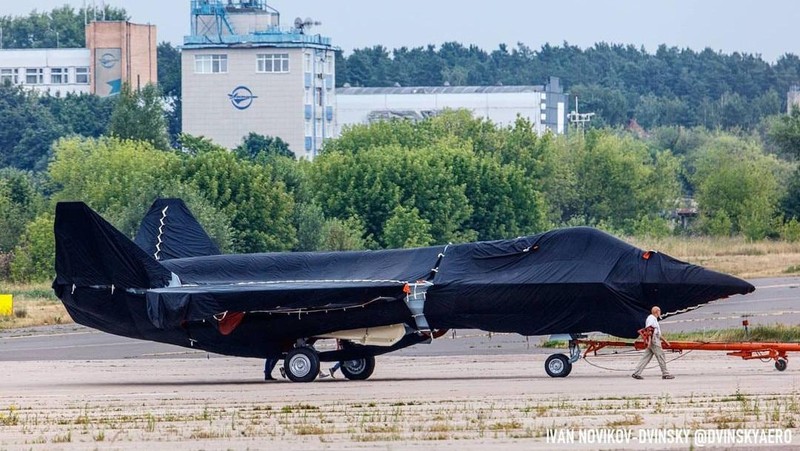 Hidden under tarpaulin, a prospective Russian fighter jet is being towed to a parking spot before its presentation at the Moscow international air show in Zhukovsky outside Moscow, Russia, Thursday, July 15, 2021. Russian aircraft makers say they will present a prospective new fighter jet at a Moscow air show that opens next week. The new warplane hidden under tarpaulin was photographed being towed to a parking spot across the airfield in Zhukovsky outside Moscow. That's where MAKS-2021 International Aviation and Space Salon opens on Tuesday. Russian President Vladimir Putin is set to visit the show’s opening. (AP Photo/Ivan Novikov-Dvinsky)