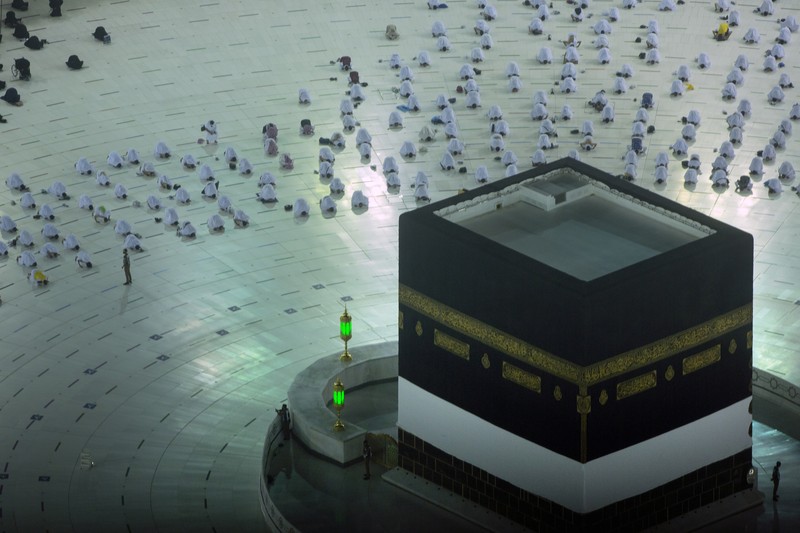 In this photo taken with low shutter speed, Muslim pilgrims circumambulate the Kaaba, the cubic building at the Grand Mosque, at the start the annual hajj pilgrimage, Sunday, July 18, 2021. The pilgrimage to Mecca required once in a lifetime of every Muslim who can afford it and is physically able to make it, used to draw more than 2 million people. But for a second straight year it has been curtailed due to the coronavirus with only vaccinated people in Saudi Arabia able to participate. (AP Photo/Amr Nabil)
