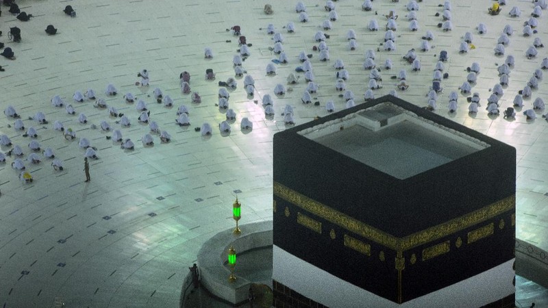 In this photo taken with low shutter speed, Muslim pilgrims circumambulate the Kaaba, the cubic building at the Grand Mosque, at the start the annual hajj pilgrimage, Sunday, July 18, 2021. The pilgrimage to Mecca required once in a lifetime of every Muslim who can afford it and is physically able to make it, used to draw more than 2 million people. But for a second straight year it has been curtailed due to the coronavirus with only vaccinated people in Saudi Arabia able to participate. (AP Photo/Amr Nabil)