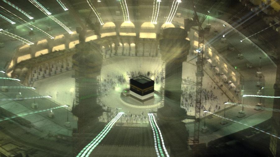 In this photo taken with low shutter speed, Muslim pilgrims circumambulate the Kaaba, the cubic building at the Grand Mosque, at the start the annual hajj pilgrimage, Sunday, July 18, 2021. The pilgrimage to Mecca required once in a lifetime of every Muslim who can afford it and is physically able to make it, used to draw more than 2 million people. But for a second straight year it has been curtailed due to the coronavirus with only vaccinated people in Saudi Arabia able to participate. (AP Photo/Amr Nabil)