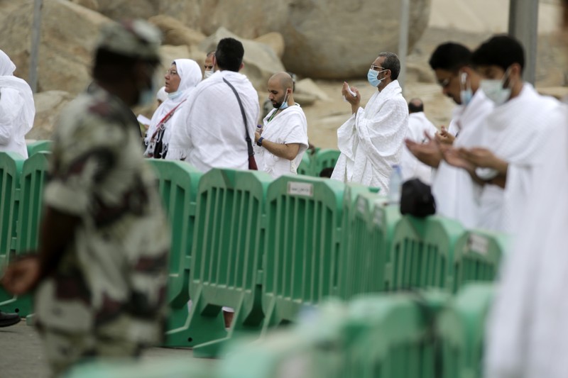 In this photo taken with low shutter speed, Muslim pilgrims circumambulate the Kaaba, the cubic building at the Grand Mosque, at the start the annual hajj pilgrimage, Sunday, July 18, 2021. The pilgrimage to Mecca required once in a lifetime of every Muslim who can afford it and is physically able to make it, used to draw more than 2 million people. But for a second straight year it has been curtailed due to the coronavirus with only vaccinated people in Saudi Arabia able to participate. (AP Photo/Amr Nabil)